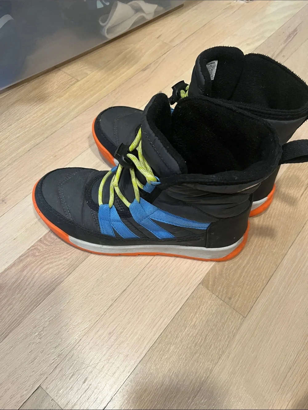 Sorel Kids Black Boots with Blue Stripes and Orange Sole
